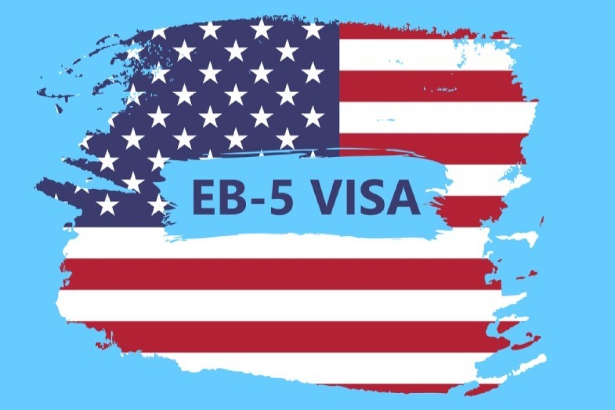 American flag background with the text EB-5 Visa written in blue on a painted blue overlay.